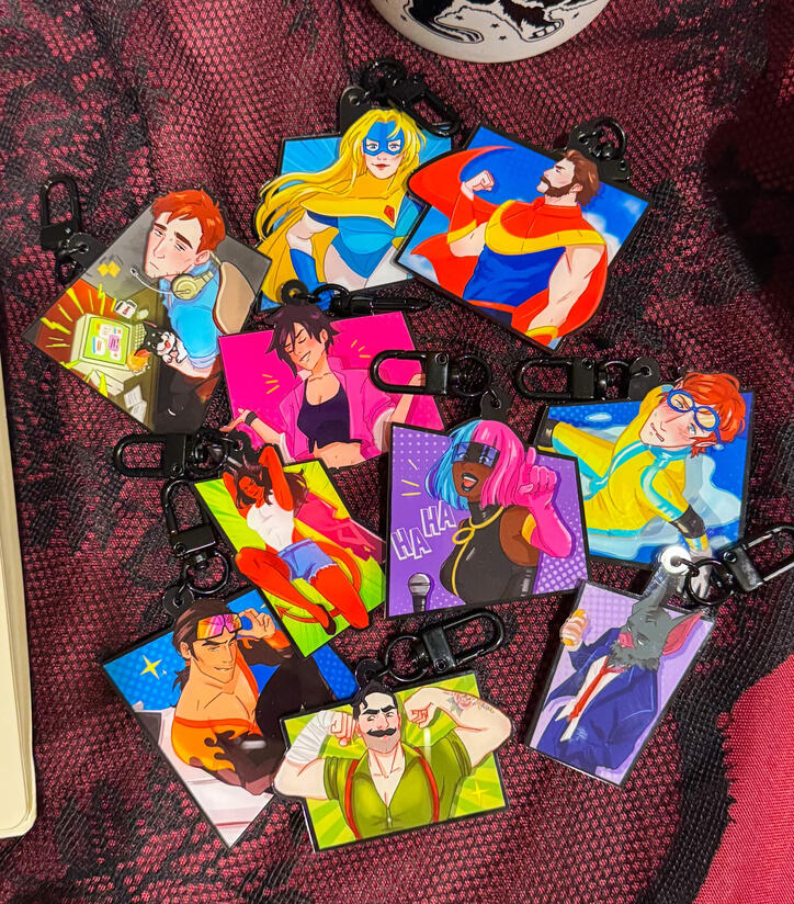2.5 in acrylic keychains with comic panel design. double-sided.