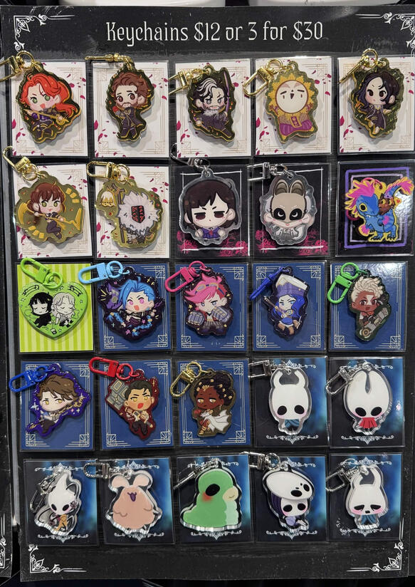 LVLUP Expo 2026 - Keychain display. All keychains ahve different custom backing cards to differentiate fandoms.