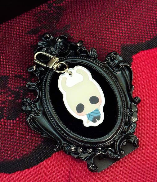 2 in acrylic charm, double sided, mirror finish. 2025.