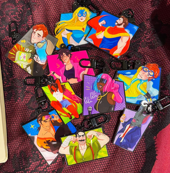 Comic panel designed keychains, with quotes on the back side. 2026.